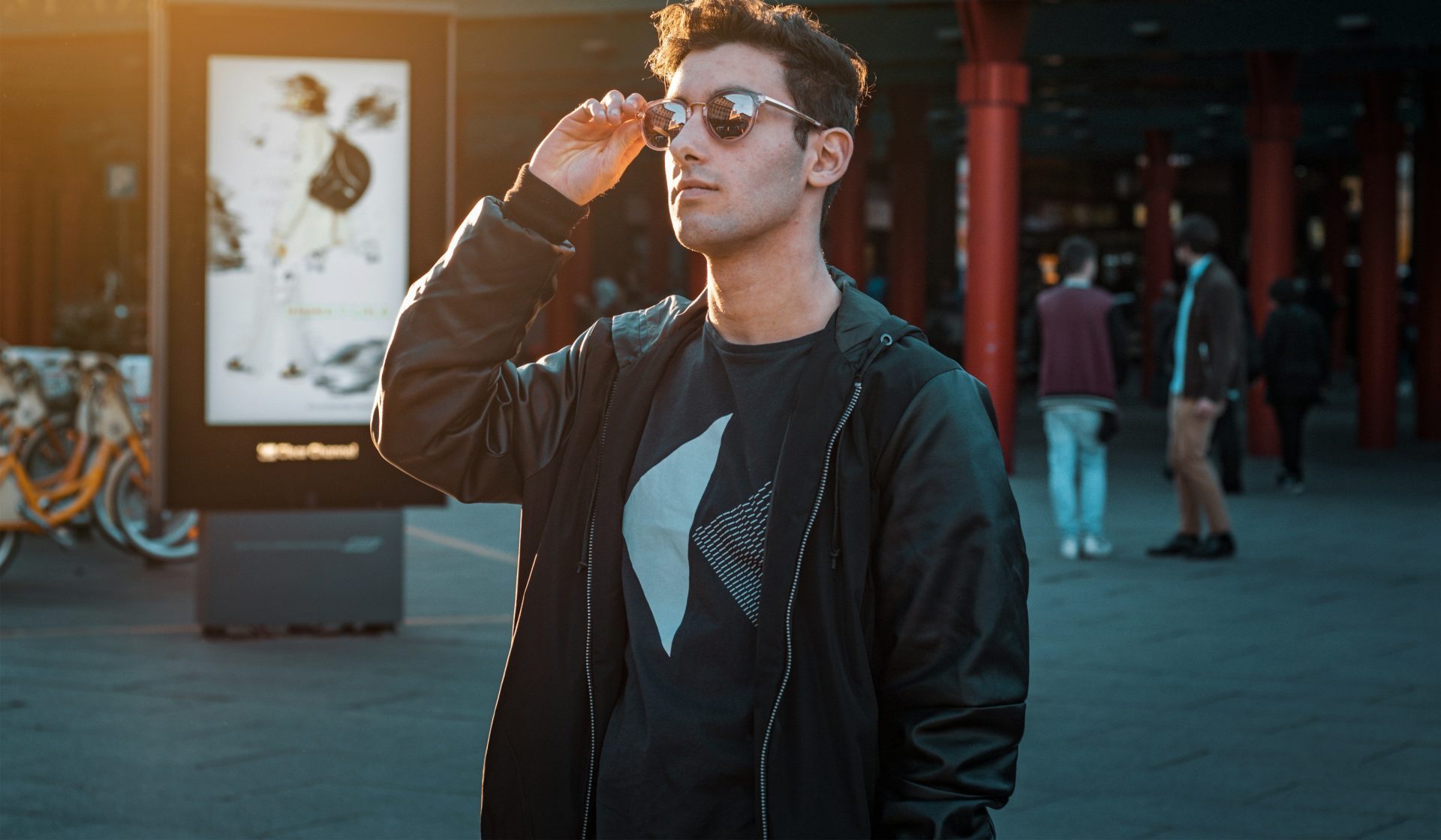man in black zip-up jacket wearing sunglasses